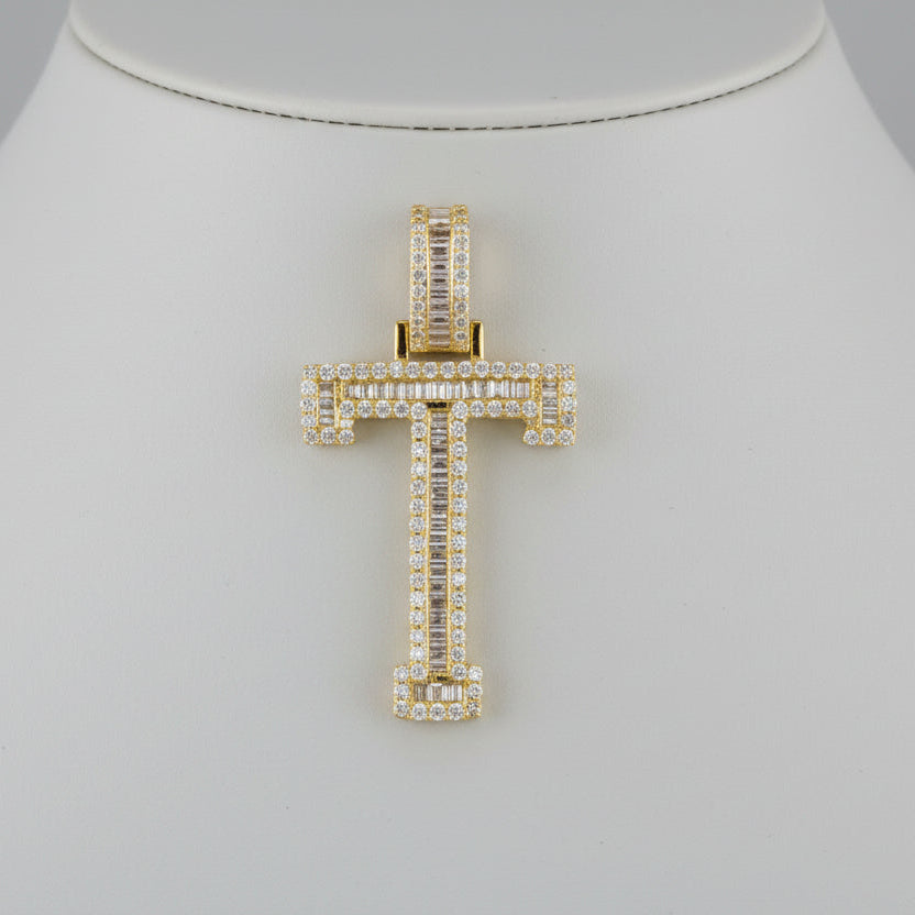 A yellow gold baguette diamond initial letter pendant with multiple stones set in a classic design.