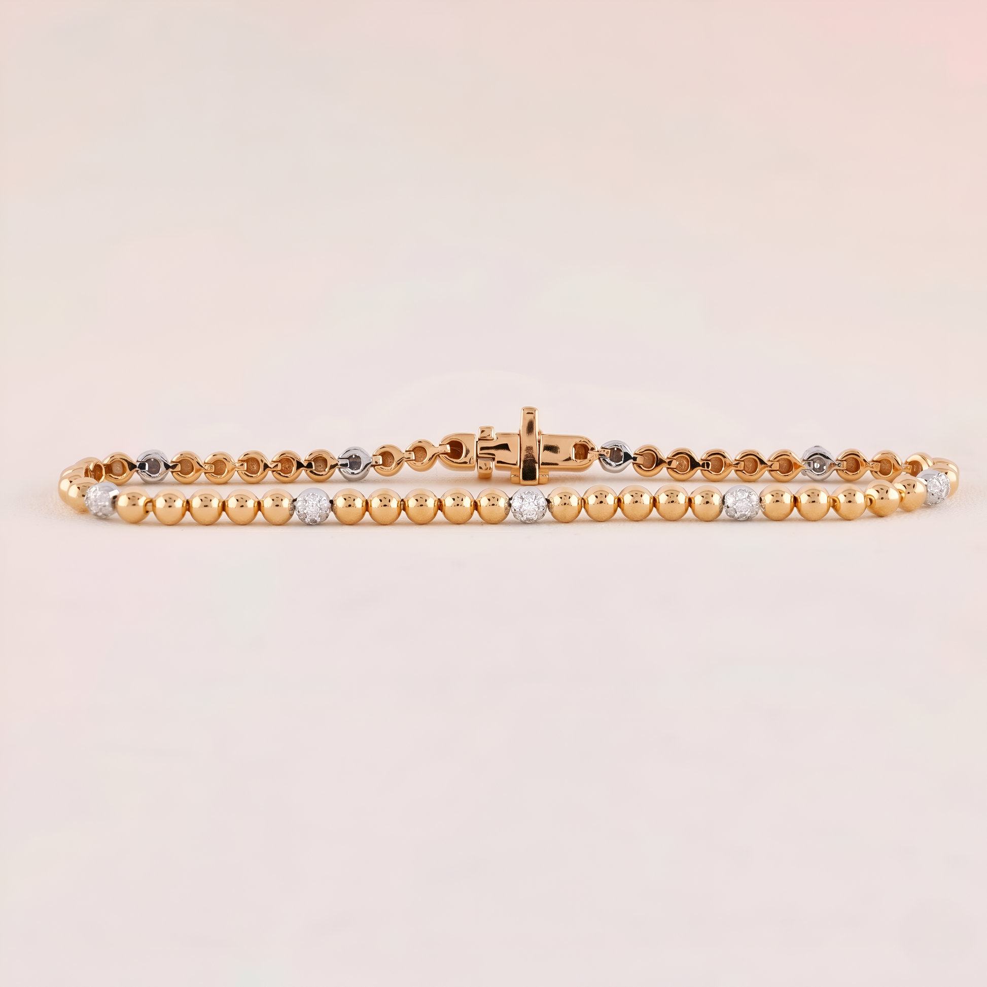 Gold and silver beaded bracelet on a light beige background