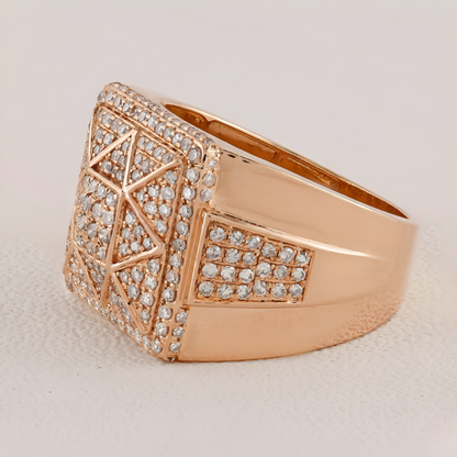 Rose gold ring with diamond accents on a light beige background