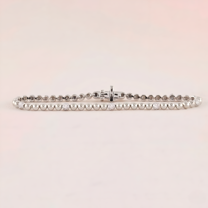 Silver bracelet on a light pink background