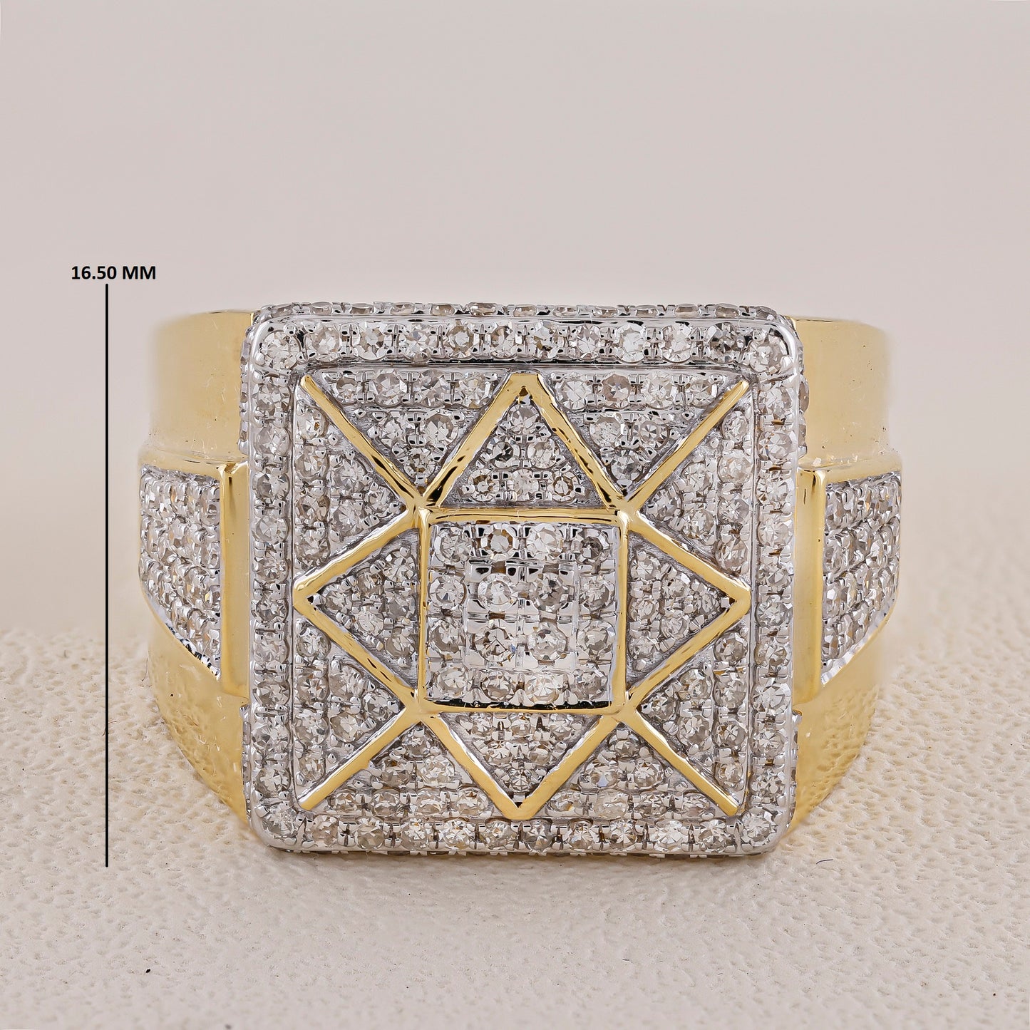 Gold and diamond-encrusted ring with geometric design on a light background