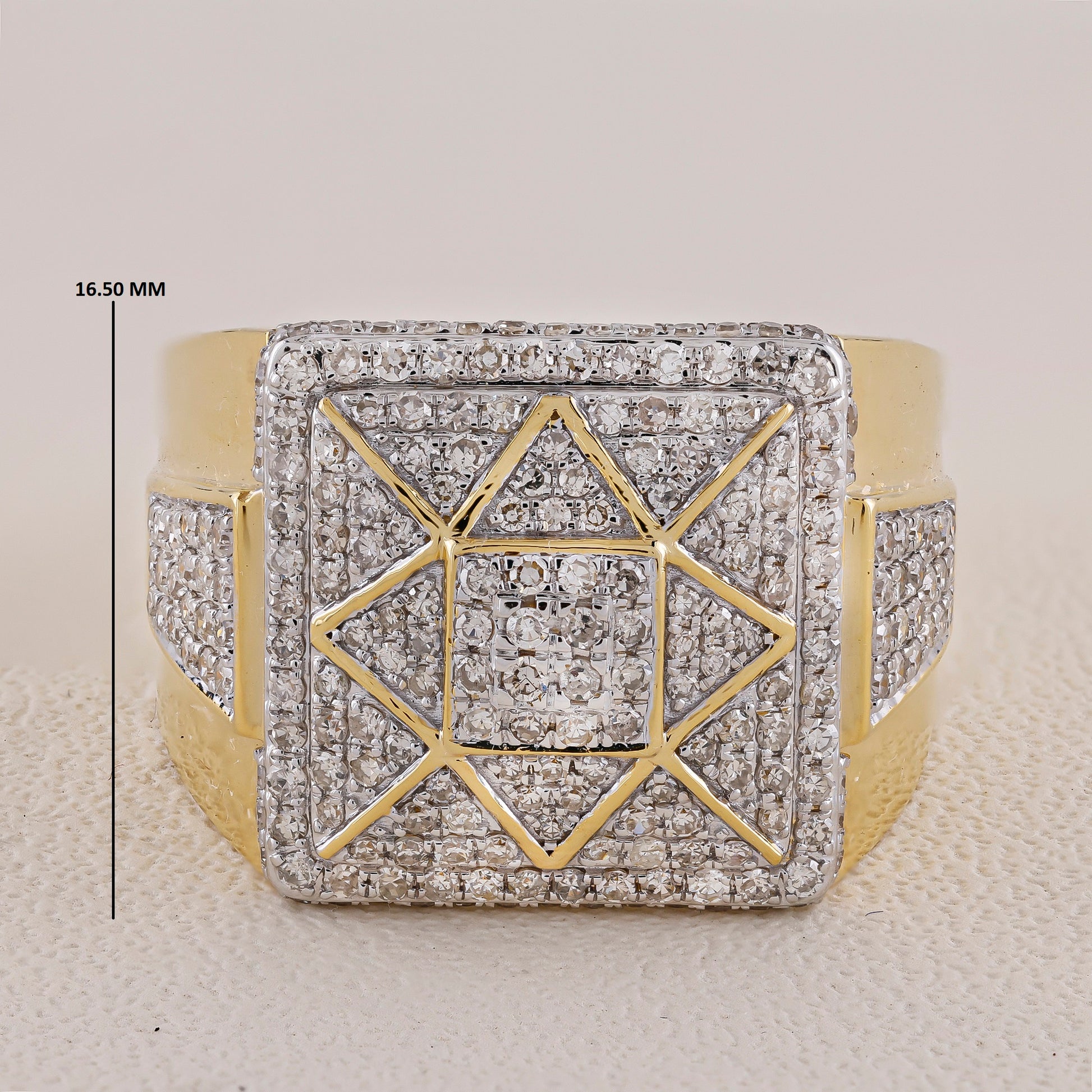 Gold and diamond-encrusted ring with geometric design on a light background