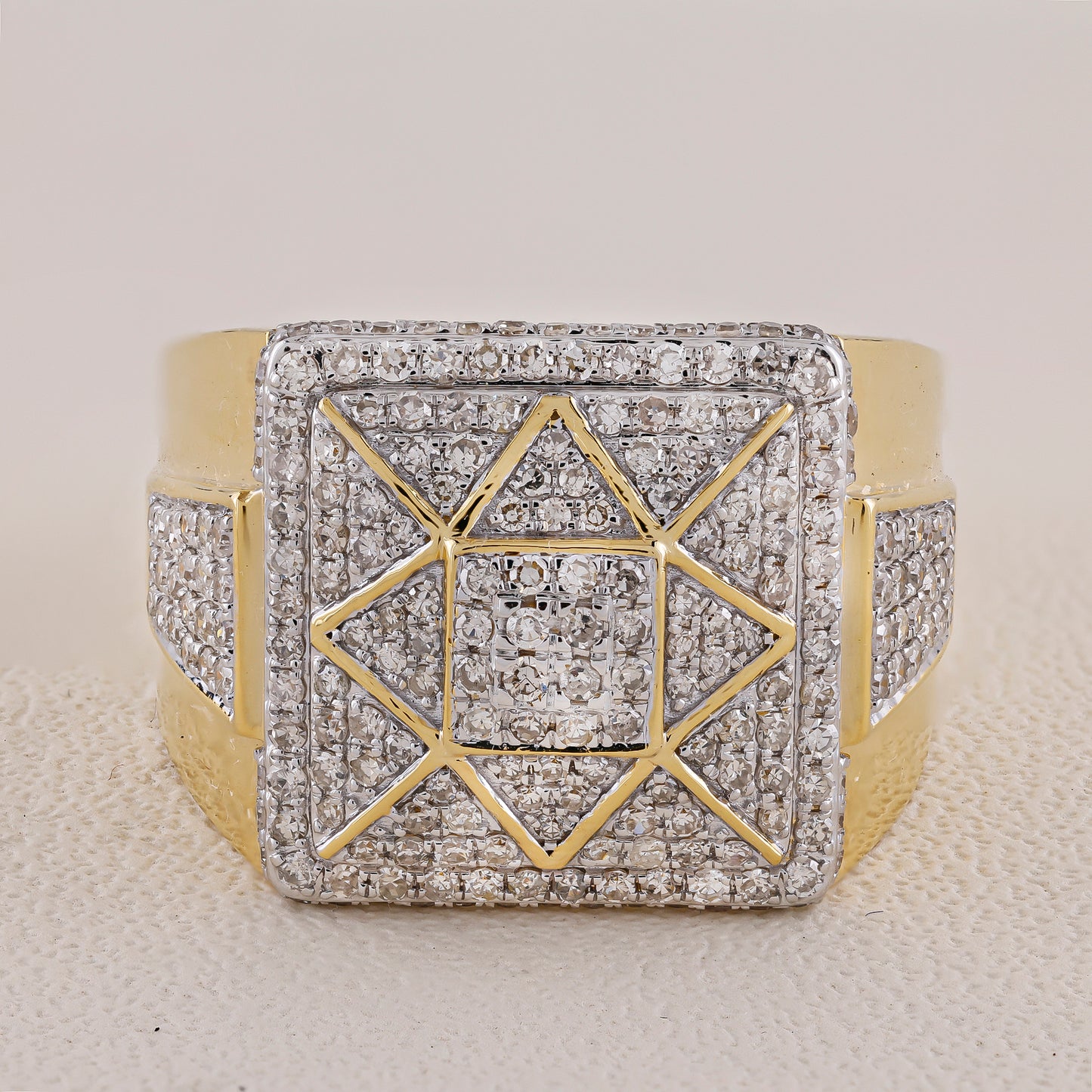 Gold and silver geometric bracelet on a textured surface