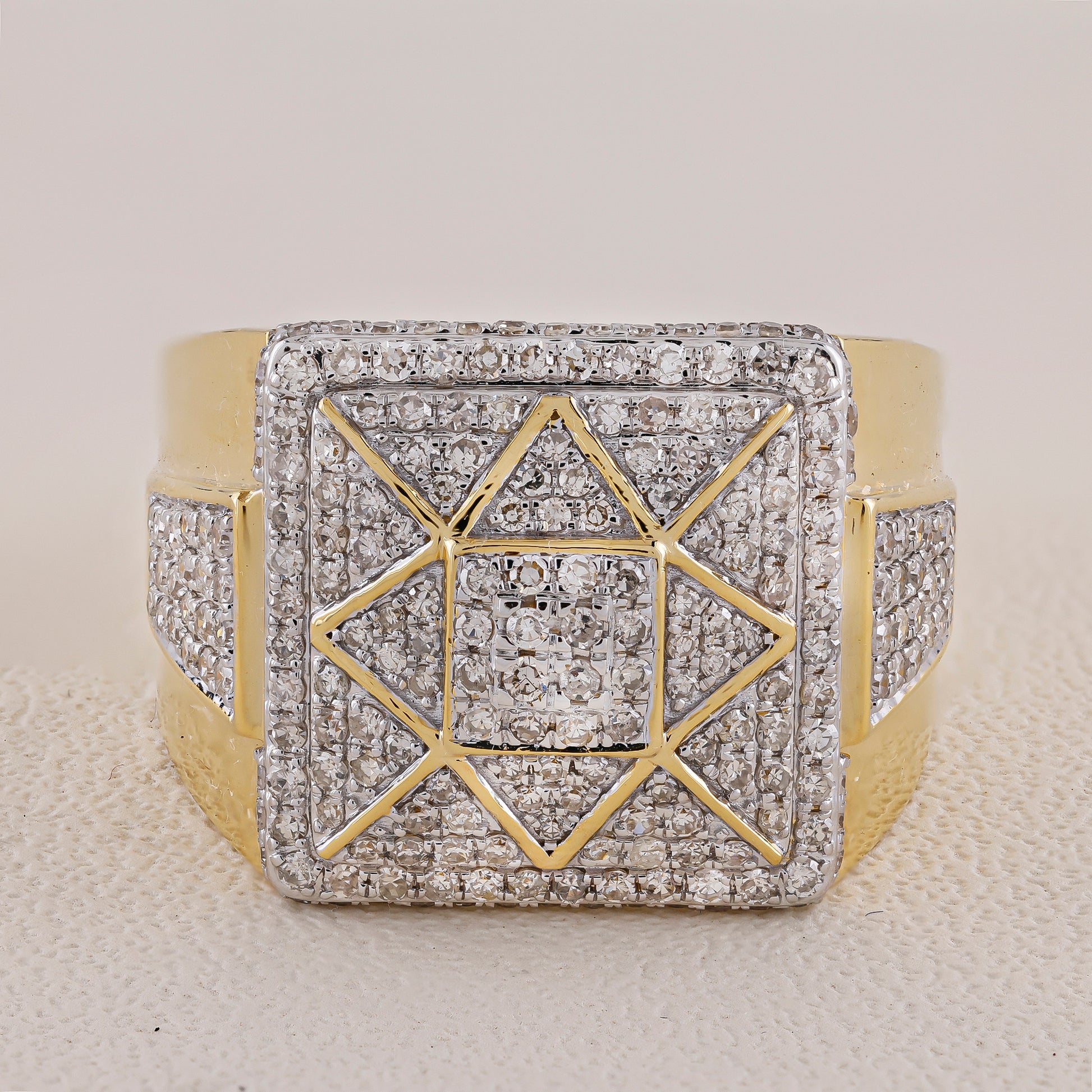 Gold and silver geometric bracelet on a textured surface