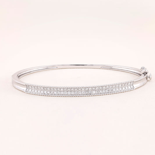 Silver bracelet with clear stones on a white background