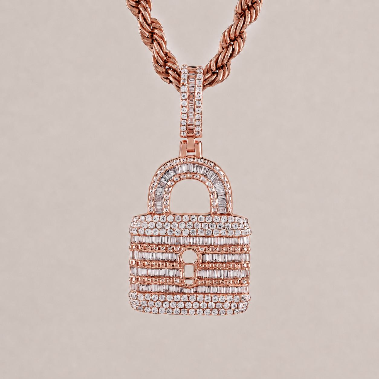 Rose gold necklace with a diamond-encrusted lock pendant on a light gray background