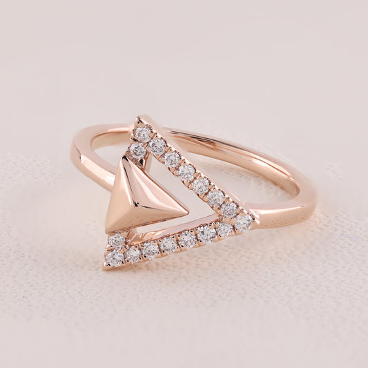 Rose gold ring with diamond accents on a light background