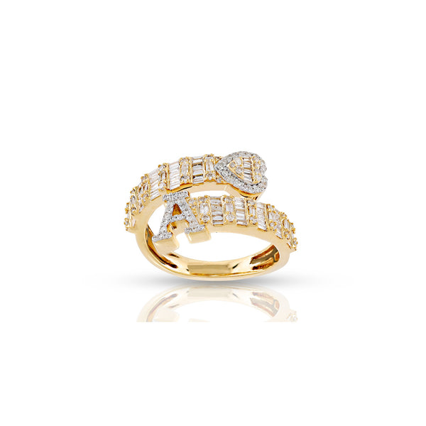A 14KT yellow gold ring featuring a heart design with baguette and round diamonds