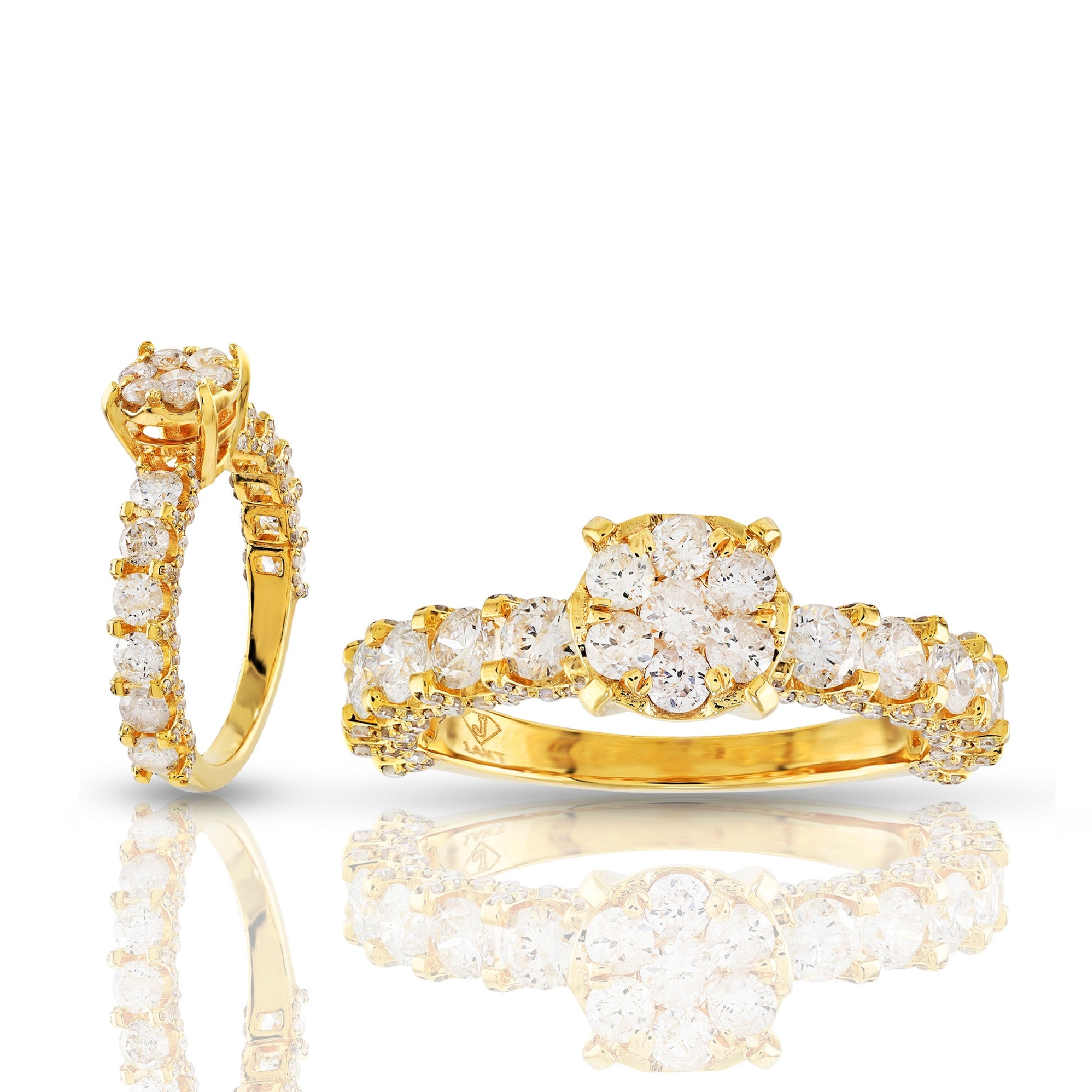 Gold earring and ring set with clear gemstones on a white background