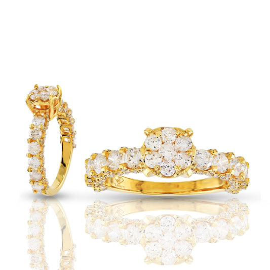Gold earring and ring set with clear gemstones on a white background