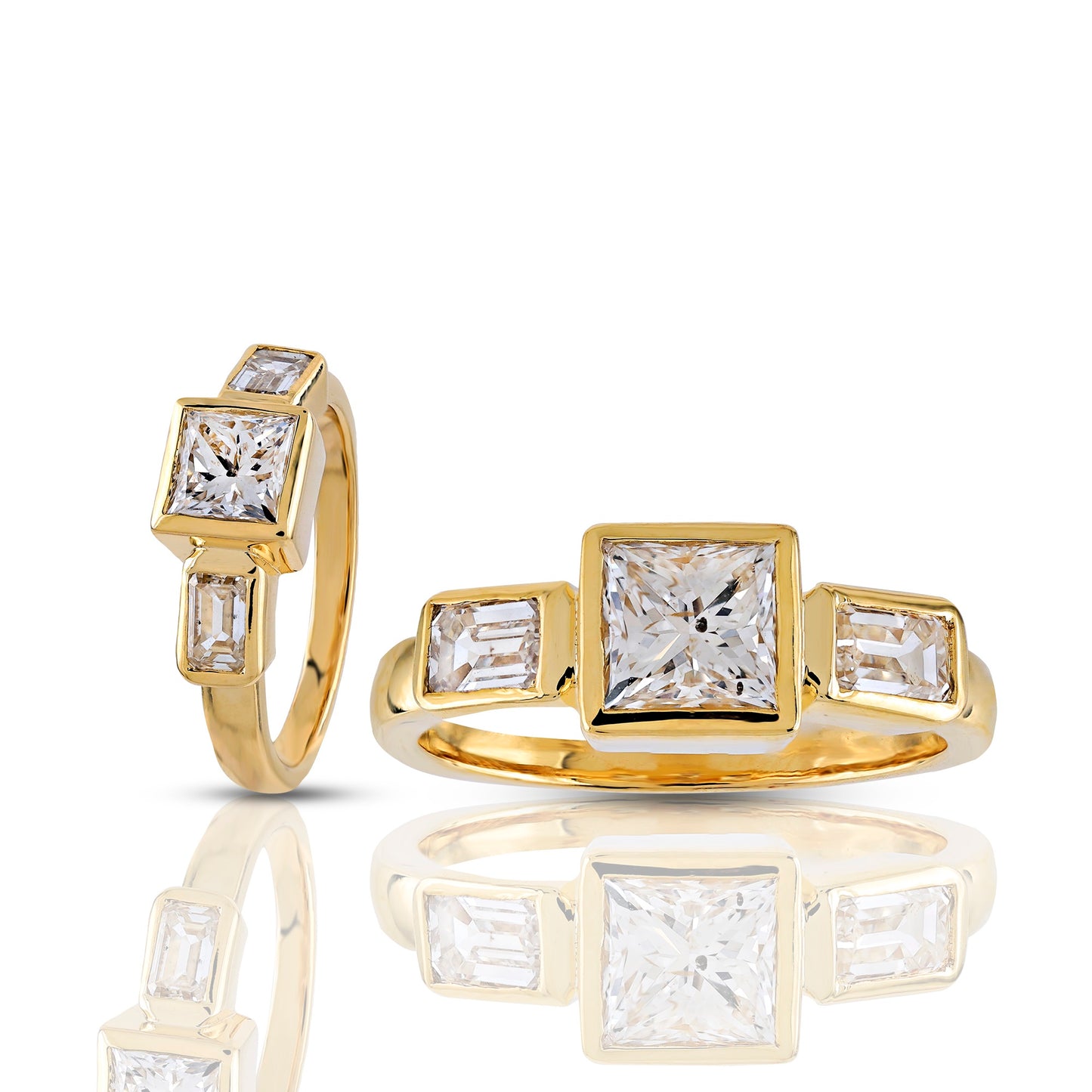 Gold ring with square and baguette cut diamonds on a white background