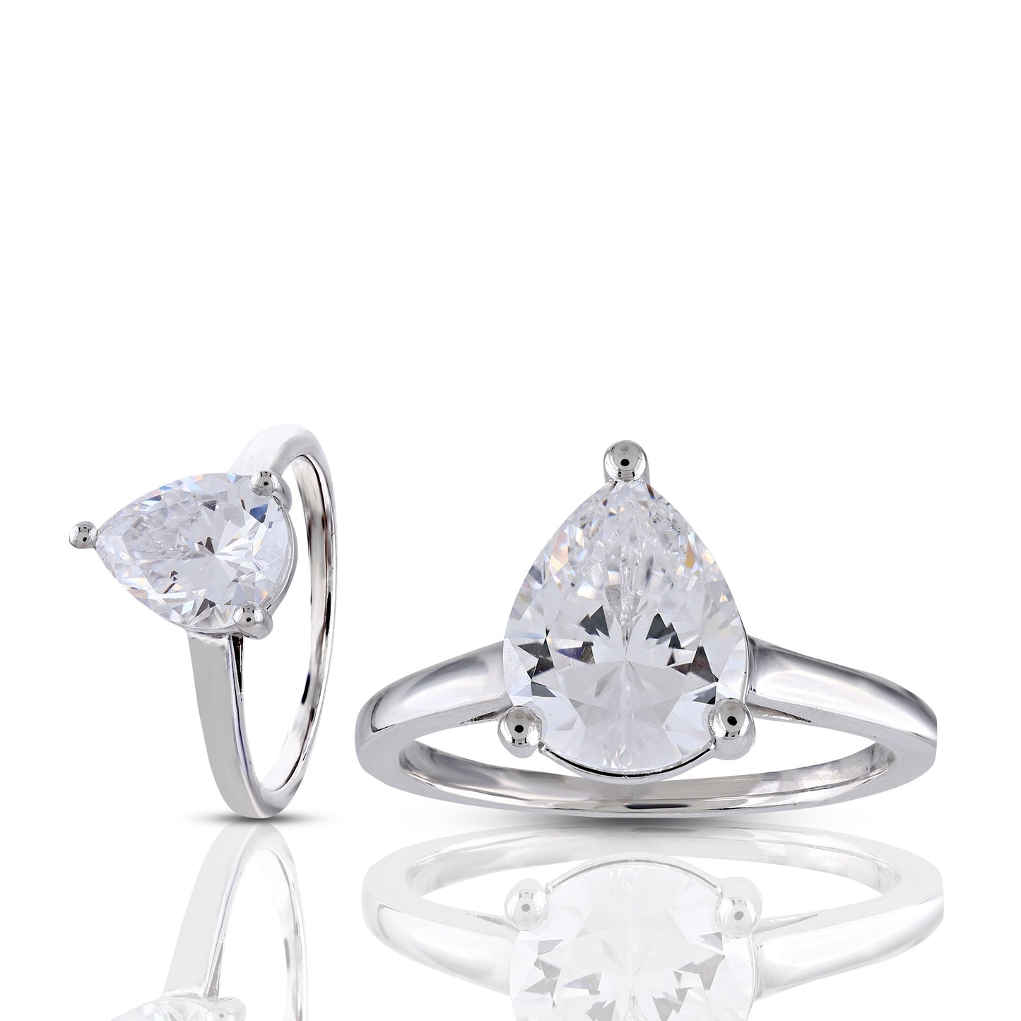 Pair of silver rings with pear-shaped gemstones on a white background