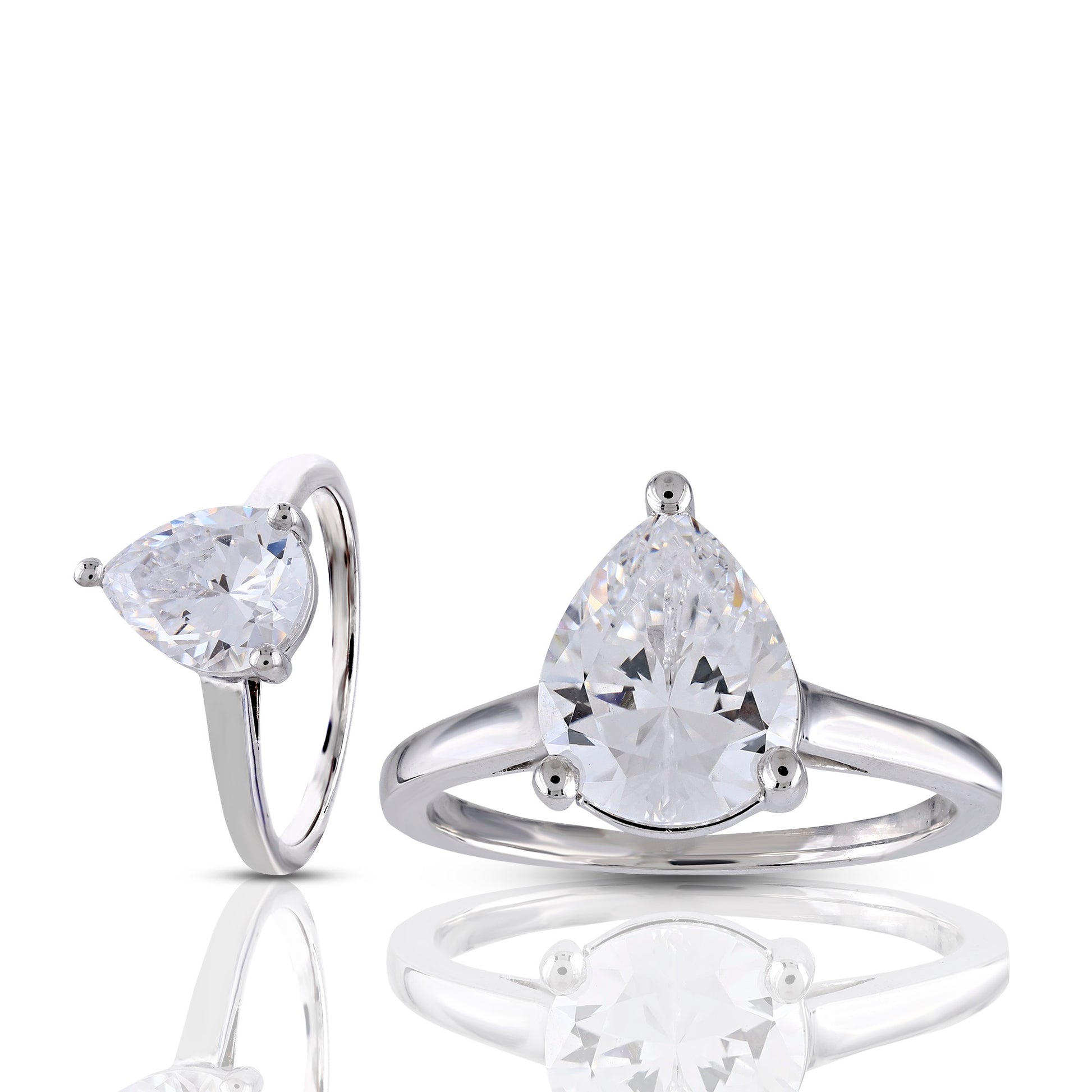 Pair of silver rings with pear-shaped gemstones on a white background