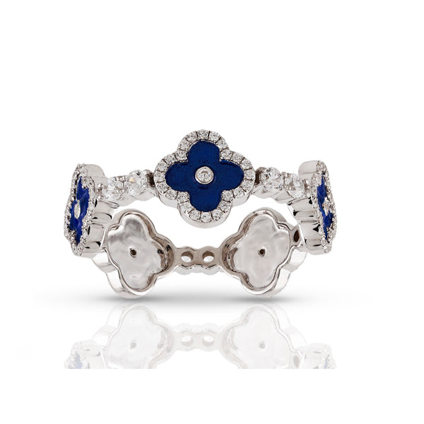 Silver ring with blue gemstones on a white background