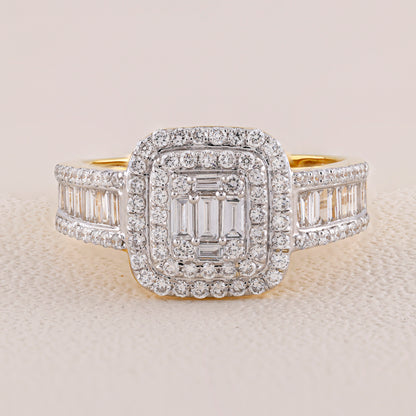 Diamond ring with a central emerald-cut stone and baguette side stones on a light background