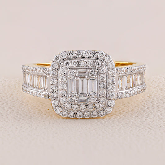 Diamond ring with a central emerald-cut stone and baguette side stones on a light background