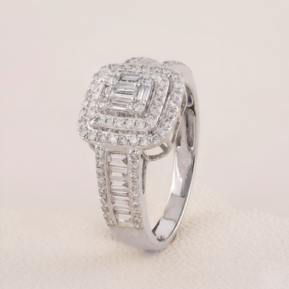 Silver ring with diamond accents on a light gray background