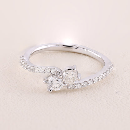 Silver ring with a diamond on a beige background