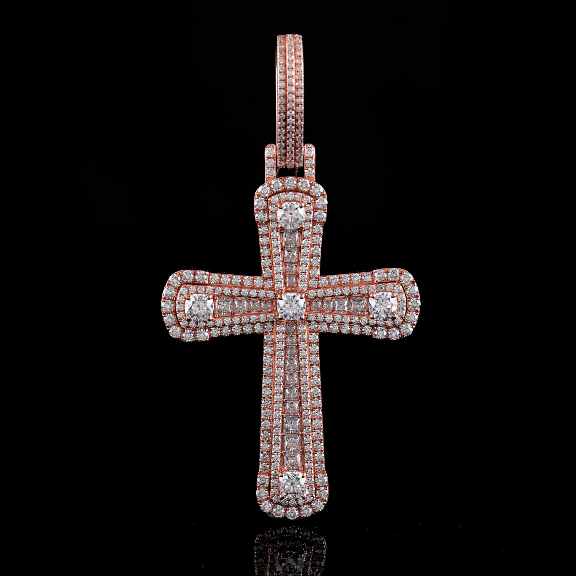 Diamond-studded cross pendant on a black background