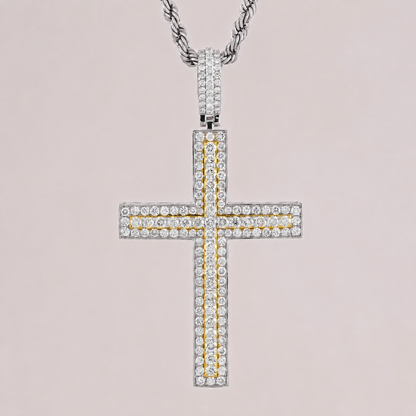Diamond cross pendant on a chain against a light pink background