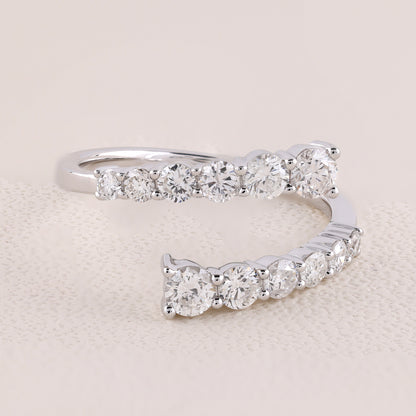 Silver ring with diamond stones on a beige background