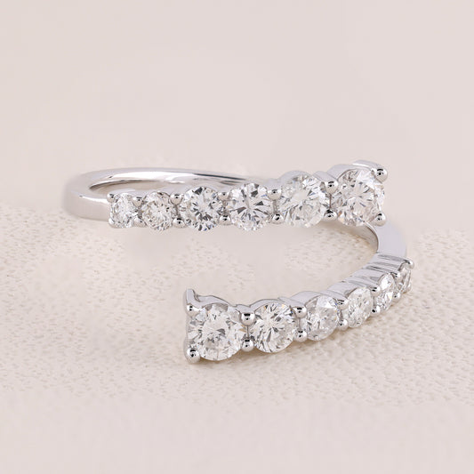 Silver ring with diamond stones on a beige background