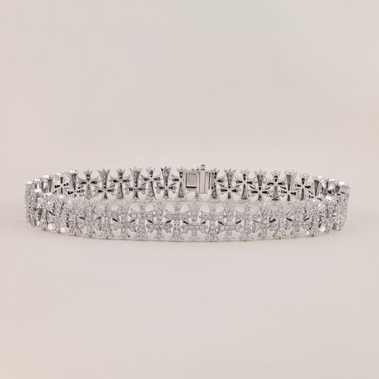 Silver bracelet with diamond accents on a light gray background