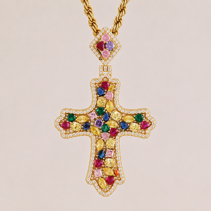 Gold cross pendant with colorful gemstones on a beige background