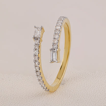 Gold hoop earrings with diamond accents on a light gray background