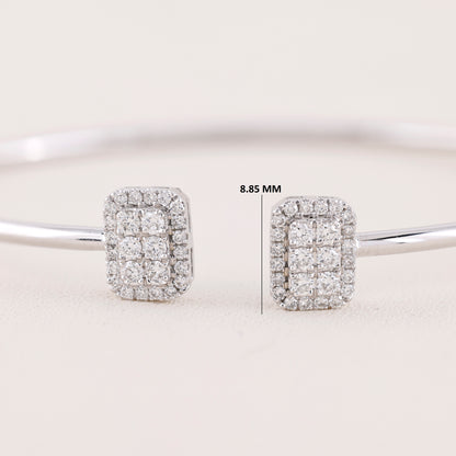 Diamond earrings on a light gray background with measurement label.