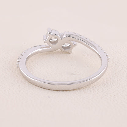 Silver ring with a unique design on a light beige background
