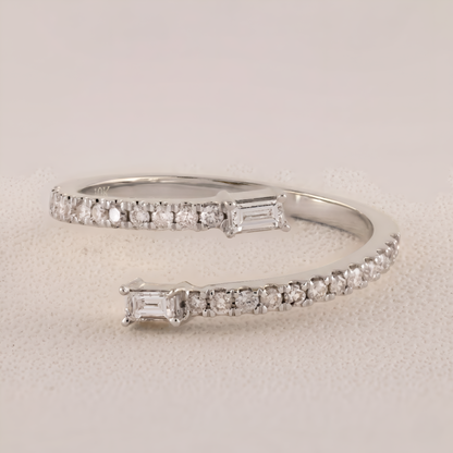 Silver bracelet with diamond accents on a light gray background