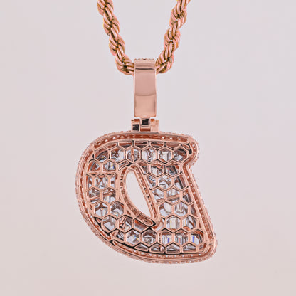 Rose gold horse bit pendant on a light gray background