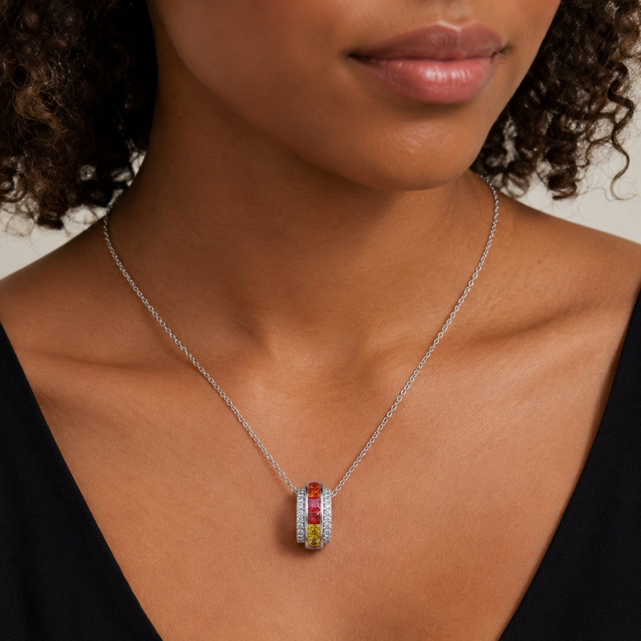 Necklace with a colorful pendant worn by a person