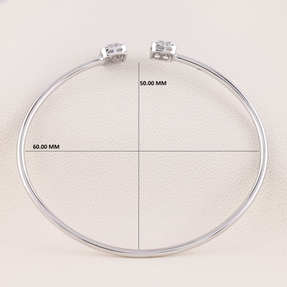Circular metal ring with measurement markings on a beige background