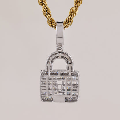 Silver padlock-shaped pendant on a gold chain against a light gray background