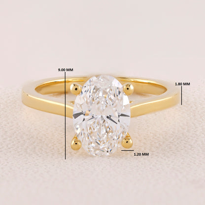 Gold ring with a diamond, showing measurements on a light background