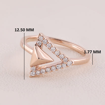 Rose gold ring with diamond accents and measurements on a light background
