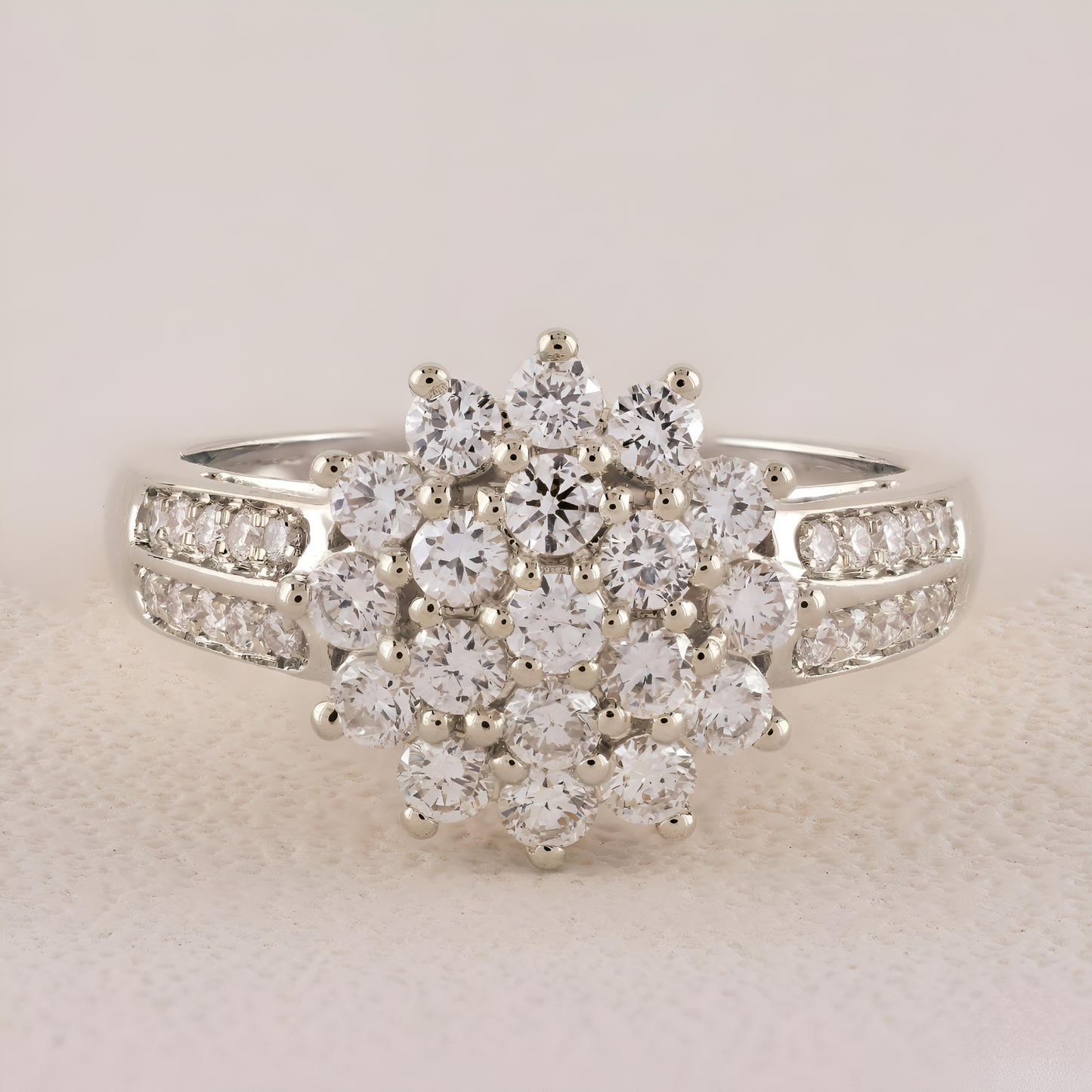 Diamond ring with a floral design on a light beige background