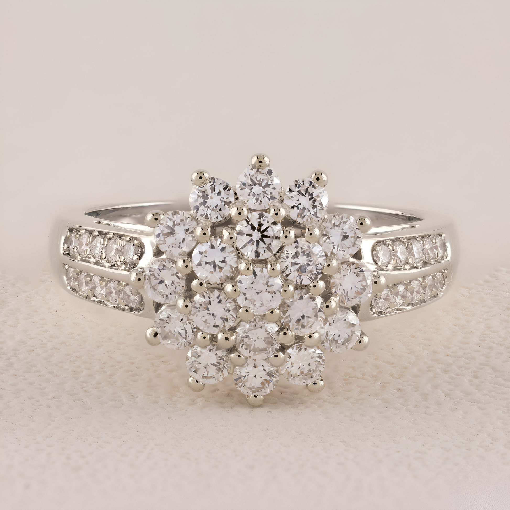 Diamond ring with a floral design on a light beige background