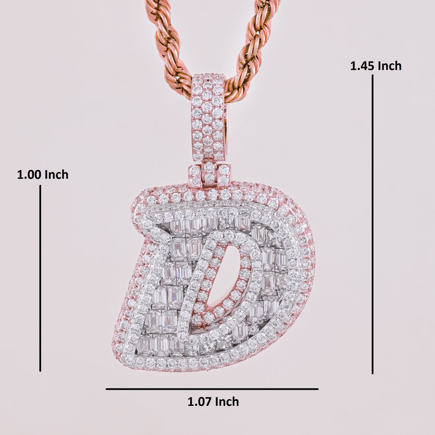 Diamond-encrusted pendant with measurements on a light pink background