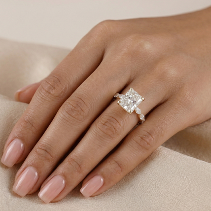 Diamond ring on a hand with a neutral background