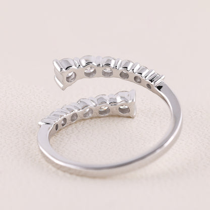 Silver ring with a unique design on a light beige background