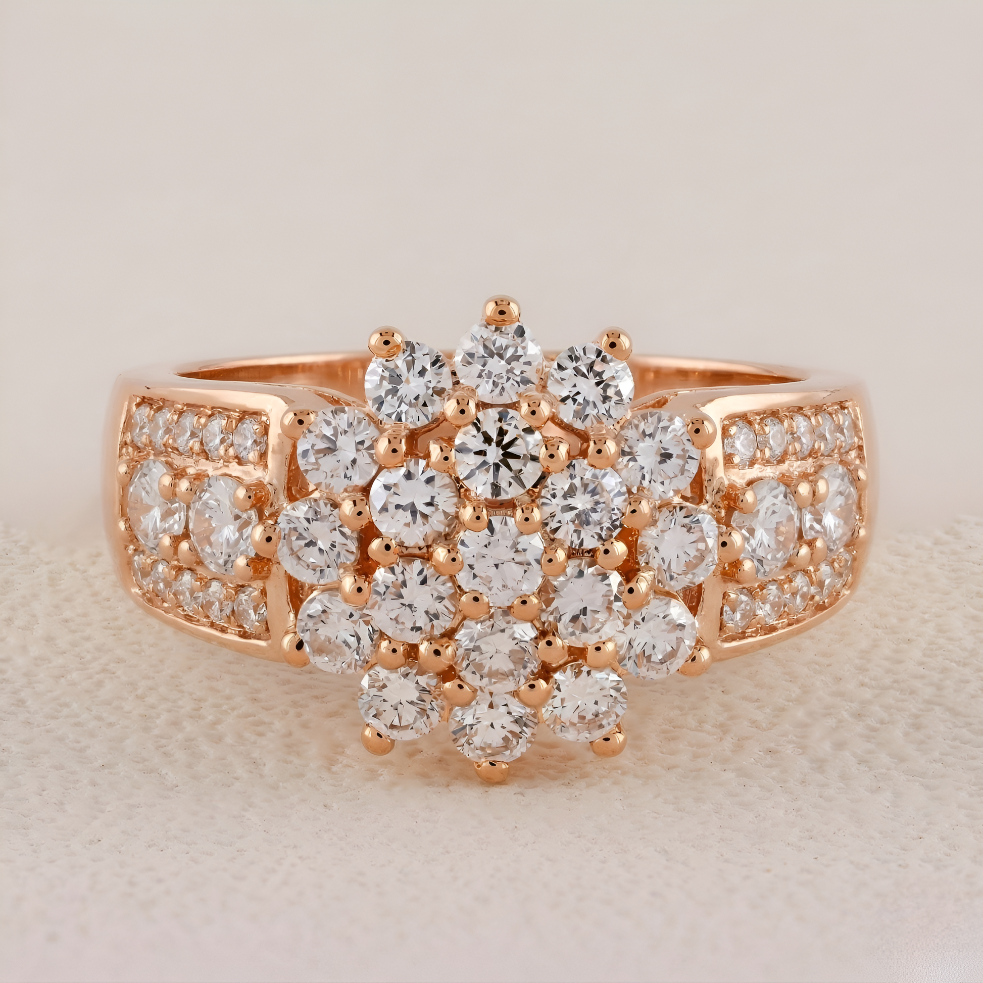 Rose gold ring with diamond stones on a beige background