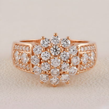 Rose gold ring with diamond stones on a beige background