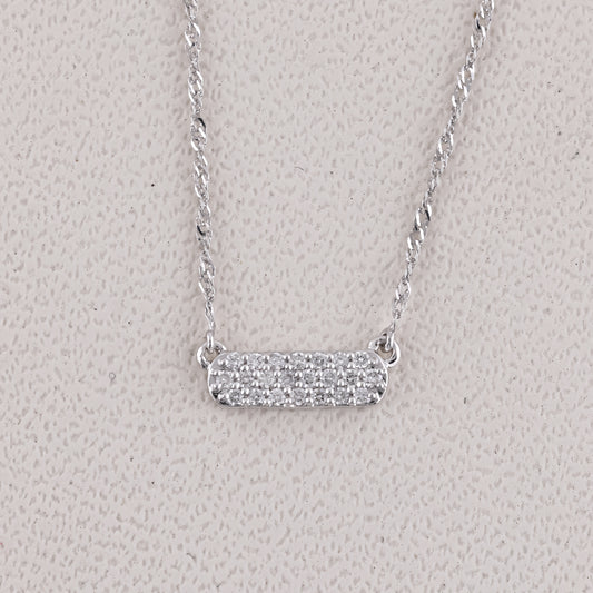 Silver necklace with a bar pendant on a light gray background