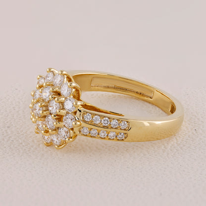 Gold ring with diamond cluster on a light beige background