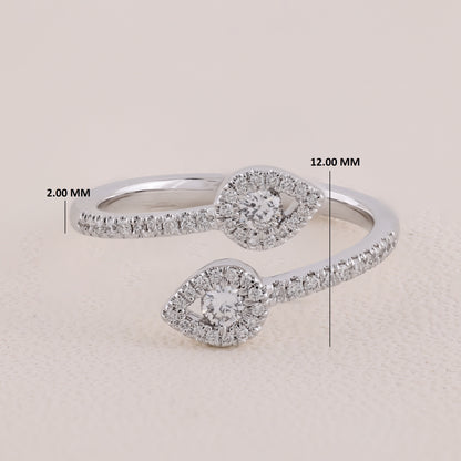 Silver ring with diamond accents and measurements on a beige background