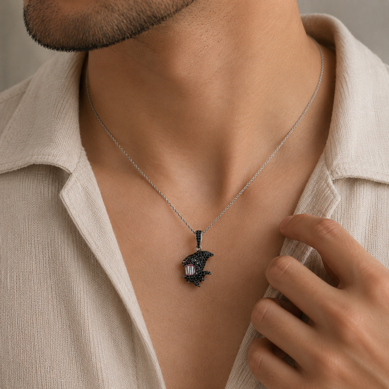 Necklace with a pendant worn by a person, focusing on the jewelry.