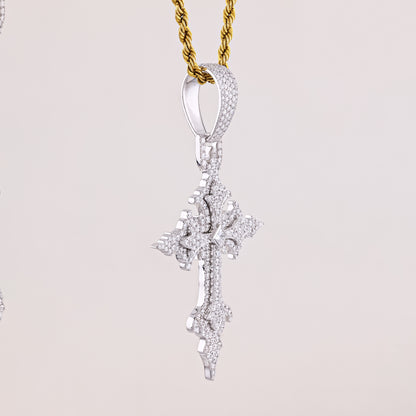 Diamond pendant on a gold chain against a light gray background